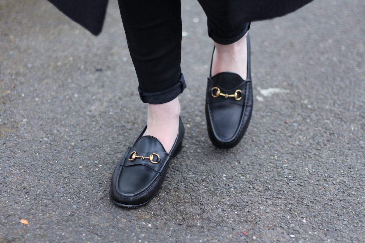 staple-all-black-look-gucci-loafers-cos-belted-coat-d&g-bag