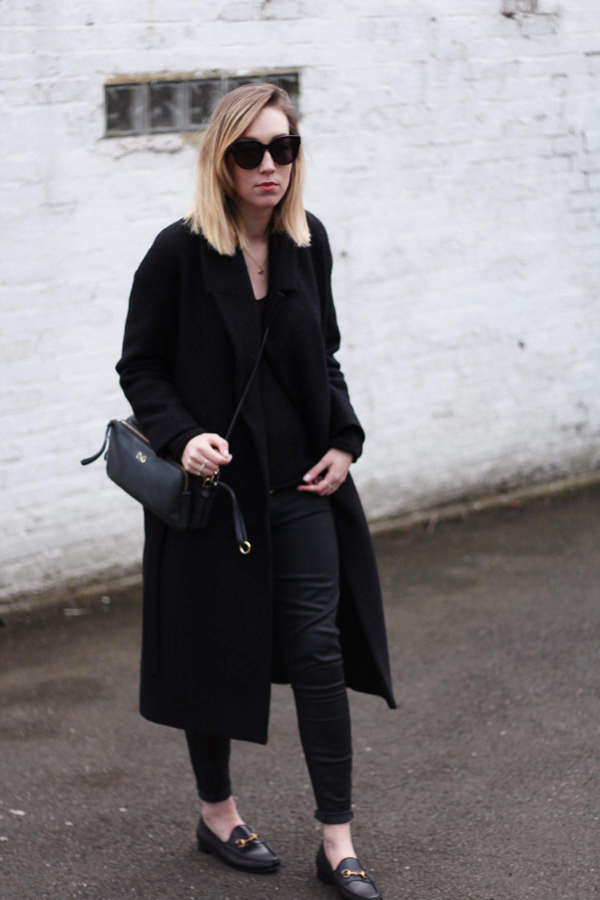staple-all-black-look-gucci-loafers-cos-belted-coat-d&g-bag-3
