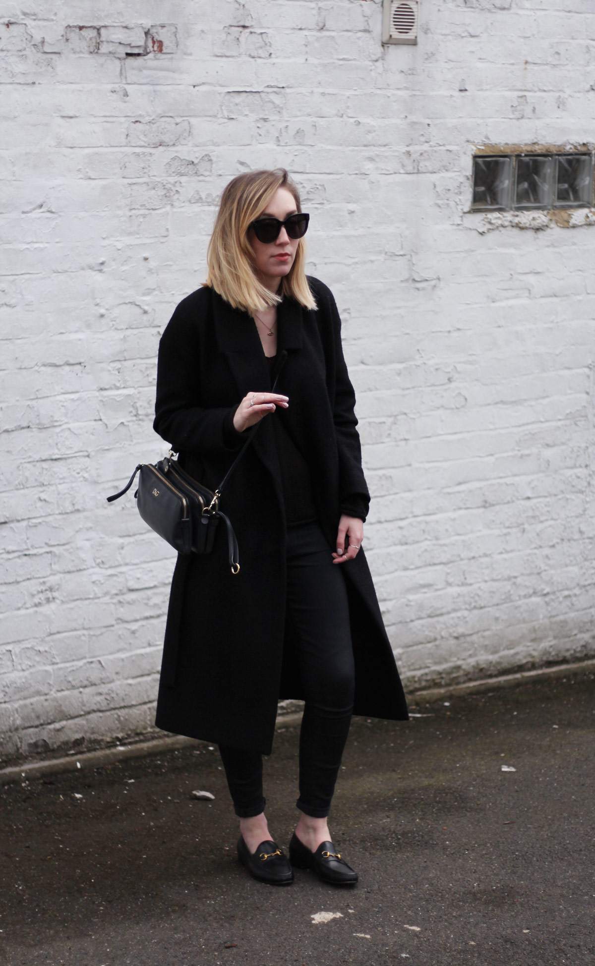 staple-all-black-look-gucci-loafers-cos-belted-coat-d&g-bag